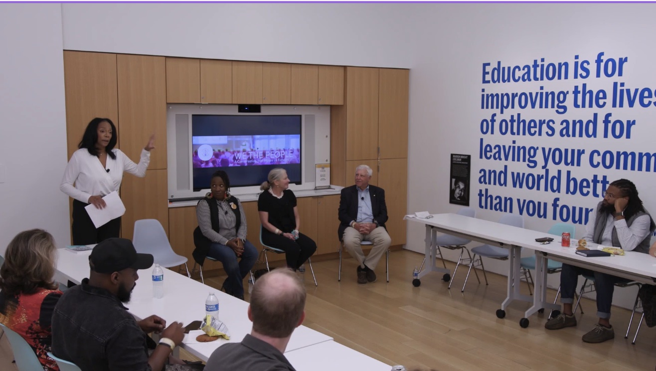 Robin hosting a community town hall